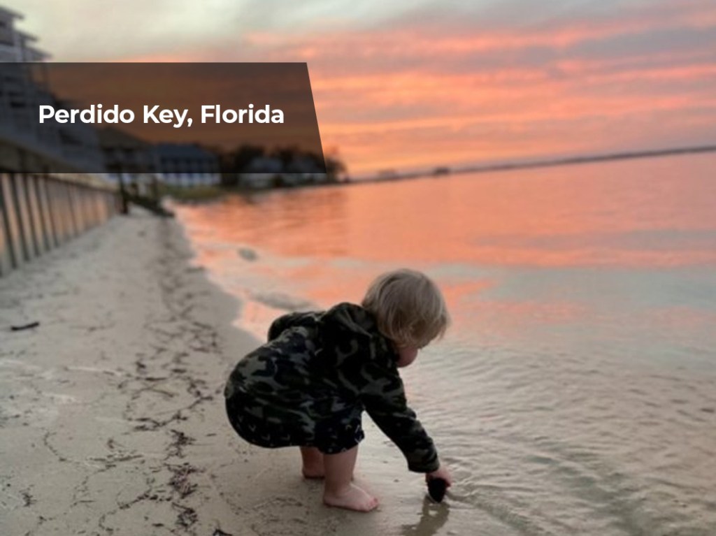 Playing in the sand during sunset in Perdido Key, Florida.